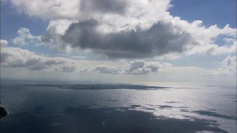 Aerial of white clouds moving over the sea on a sunny day, Arhus Island With Stock Footage 109120721