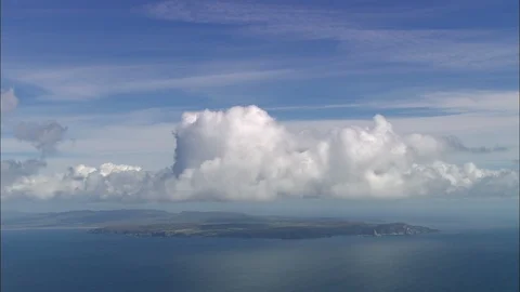 Aerial of white clouds on the ocean, End Of Islay With Large White Cloud Above Stock Footage 108584887