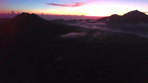 Aerial of white clouds over the landscape and mountains at sunset Stock-Footage 81448204