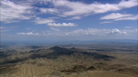 Aerial of white clouds over the mountainous landscape, Big blue sky with wispy Stock Footage 109120867