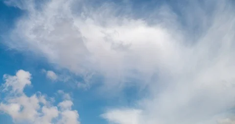 Aerial white fluffy clouds moving out in the sky Stock Footage 93547747