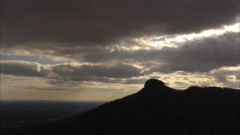 Aerial of white puffy clouds over mountain top, Dramatic sky and silhouette Stock Footage 109140276
