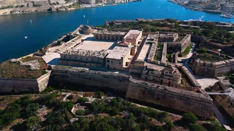 Aerial wide angle high drone shot cinematic over fort Manoel Malta at summer Stock Footage 335328286