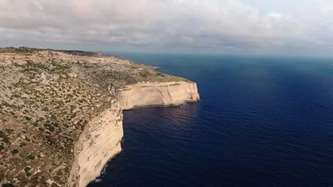 Aerial wide angle landscape drone shot flying towards the dingli cliffs, malta Stock Footage 336431948