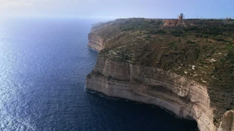 Aerial wide angle landscape slow panning left drone shot of the dingli cliffs Stock Footage 336466950