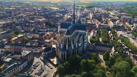 Aerial wide angle panning drone view of the Notre Dame D'amiens in France at Stock Footage 341315420