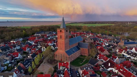 Aerial wide angle panoramic view of a massive historic medieval brick church Stock Footage 339279489