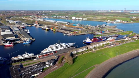 Aerial wide angle panoramic view of a bustling seaport harbor with industrial Stock Footage 339300364
