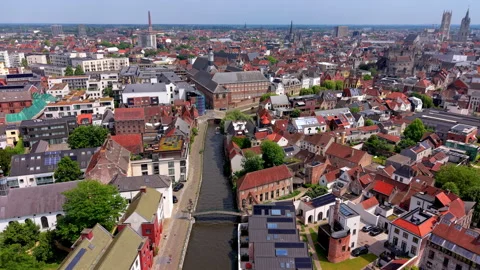 Aerial wide angle panoramic view looking down a narrow urban city river canal Stockbeeldmateriaal 339300955