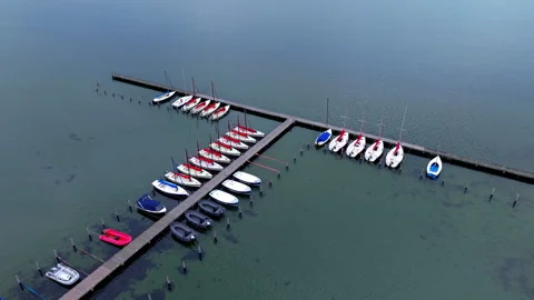 Aerial wide angle panoramic view of small white sailboats and motorboats Stock Footage 339632873