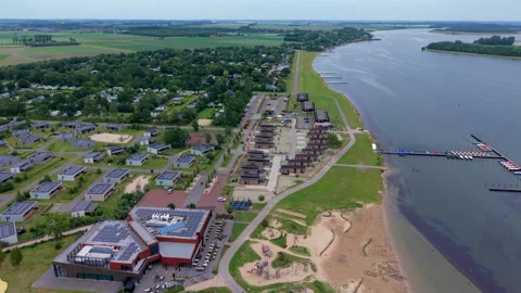 Aerial wide angle panoramic view of a modern lakeside holiday resort Stock Footage 339633211