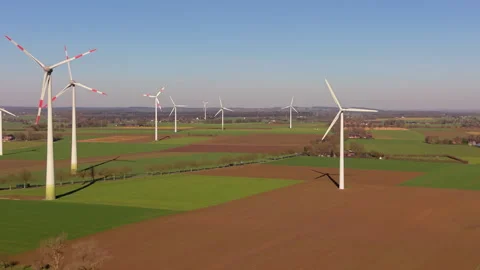 Aerial wide angle panoramic view of modern white wind turbines generating Stock Footage 339976777