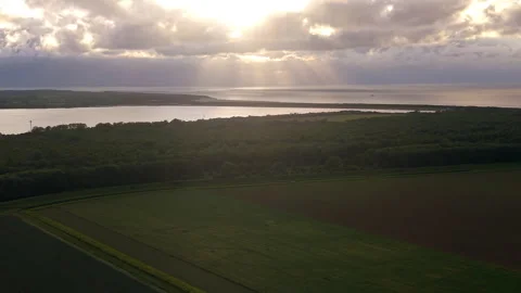 Aerial wide angle panoramic view of sun rays crepuscular beams breaking Stock Footage 340107832