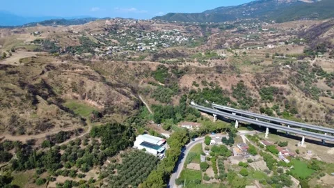 Aerial wide angle panoramic view of highway bridge to mountain tunnel Stock Footage 343962640