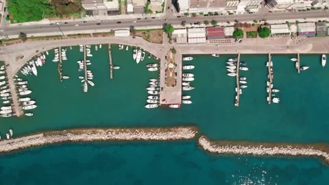 Aerial wide angle shot of a compact marina filled with boats and yachts Stock Footage 343944707