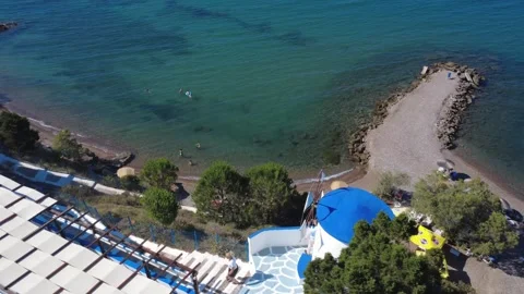 Aerial wide angle shot of a traditional white windmill next to a hotel. Stock Footage 343940468
