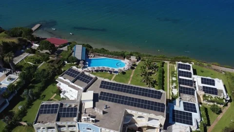 Aerial wide angle view of extensive hotel with solar panels in Greece Stock Footage 343940691