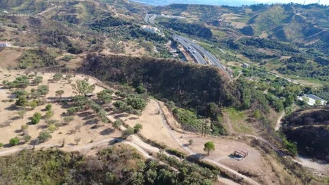 Aerial wide angle view of highway overpass and valley viewpoint Stock Footage 343960606