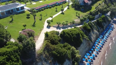 Aerial wide angle view of luxury hotel cliff garden in Greece Stock Footage 343940503
