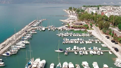 Aerial wide angle view of marina with yachts along a coastal city Stock Footage 343946111