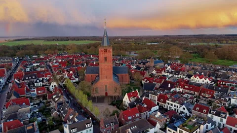 Aerial wide angle view of a massive historic medieval brick church cathedral Stock Footage 339279350