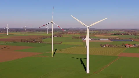 Aerial wide angle view of multiple tall wind turbines generating clean energy Stock Footage 339222360