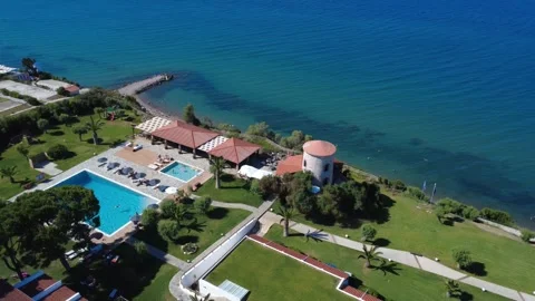Aerial wide angle view of premium coastal hotels with pool in Greece Stock Footage 343940380