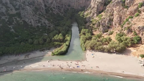 Aerial wide angle view of Preveli river oasis and exotic beach Stock Footage 344547923