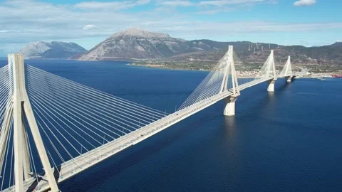 Aerial wide angle view of Rio-Antirrio Bridge spanning open sea Stock Footage 338109277