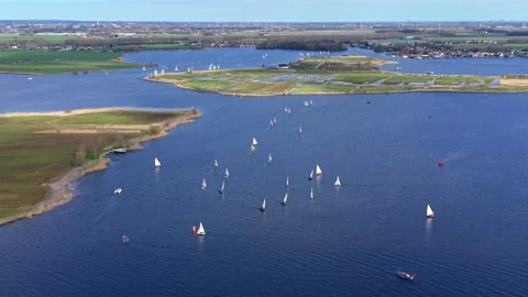 Aerial wide angle view of a sailing regatta with numerous small sailboats Stock Footage 339224755