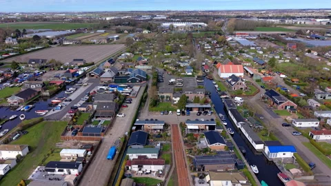 Aerial wide angle view of a scenic marina canal inside a holiday village Stock Footage 339223983
