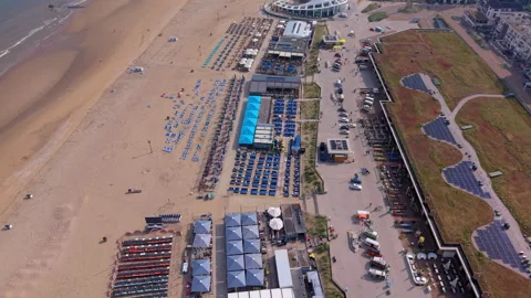 Aerial wide angle view of Scheveningen beach promenade with modern green Stock Footage 339631826
