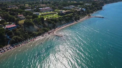 Aerial wide angle view of shimmering sea and beach resorts in Greece Stock Footage 343940841