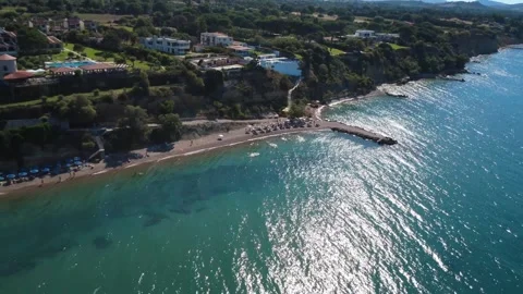 Aerial wide angle view of the sun reflecting on the bright sea water. Stock Footage 343940236