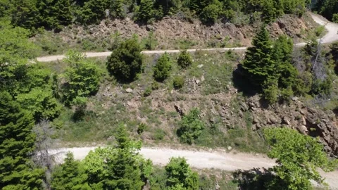 Aerial wide angle view of telecom tower road and mountain forest terrain Видео 343949092