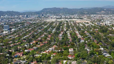 Aerial wide pullback shot of Los Angeles residence, homes, Hollywood, trees Stock Footage 308106203