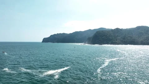 Aerial Wide Shot of Forested Java Coast and Turquoise Sea Near Green Island Video stock 335283439