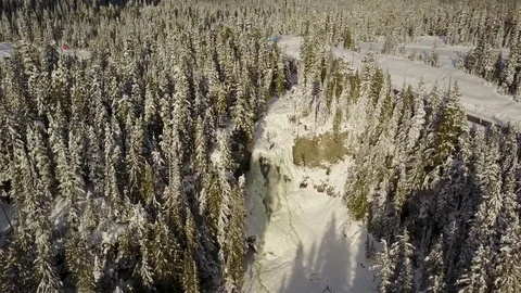Aerial Wide Shot Of Frozen Waterfalls And Winter Mountain Landscape Stock Footage