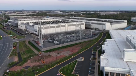 Aerial wide shot of modern data center campus in Ashburn, Virginia, USA, with Stock Footage 333880761