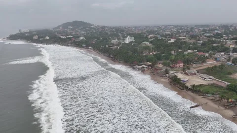 Aerial Wide View of Breaking Waves and Coastline at Accra Beach, Ghana Stock Footage 329503671