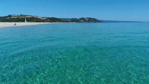 Aerial wide view of Possidi sand cape sandbank reaching into crystal clear 스톡 동영상 348232853