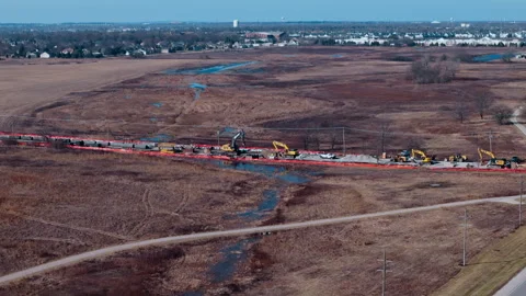 Aerial wide view of road construction with underground water pipeline Stock Footage 338319542