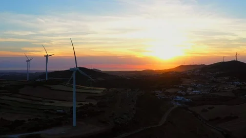 Aerial Wind turbine generators at sunset. Eco renewable energy power production. Stock Footage 109028367