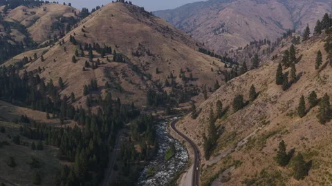 Aerial of winding highway 55 through Boise National Forest valley in Idaho Stock-Footage 341829789