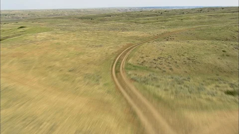 Aerial of winding mountain path through green landscape, Lonely landscape Stock Footage 109458953
