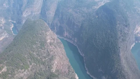 Aerial the winding river through deep mountain canyons in Chongqing China Stock Footage 342306150