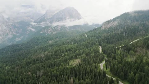 Aerial winding road through dense coniferous forest near Lake Misurina. Sce.. Stock Footage 332264194