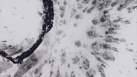 Aerial - Winter landscape with a river at a light snowing Stock Footage 75635401