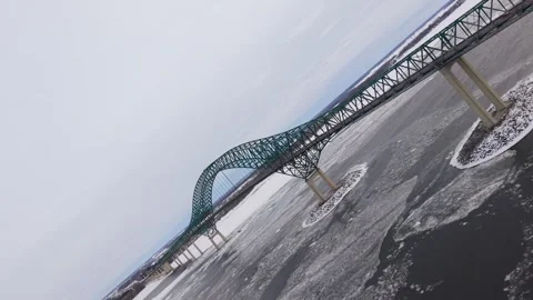 Aerial winter road bridge with continuous car movement Stock Footage 329395643