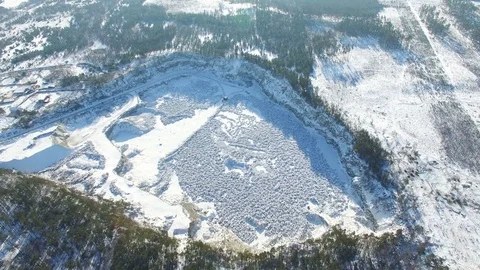 Aerial. Winter time and pit on production of  stone with a ditch Stockbeeldmateriaal 85136547